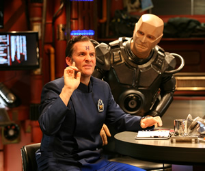 Red Dwarf. Image shows from L to R: Rimmer (Chris Barrie), Kryten (Robert Llewellyn). Copyright: Grant Naylor Productions / BBC