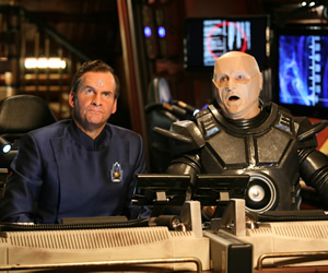 Red Dwarf. Image shows from L to R: Rimmer (Chris Barrie), Kryten (Robert Llewellyn). Copyright: Grant Naylor Productions / BBC