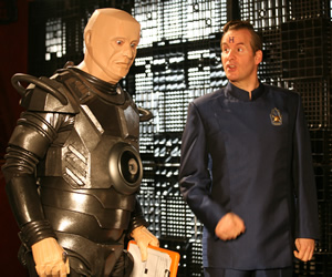 Red Dwarf. Image shows from L to R: Kryten (Robert Llewellyn), Rimmer (Chris Barrie). Copyright: Grant Naylor Productions / BBC