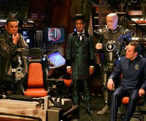 Red Dwarf. Image shows from L to R: Lister (Craig Charles), Cat (Danny John-Jules), Kryten (Robert Llewellyn), Rimmer (Chris Barrie). Copyright: Grant Naylor Productions / BBC