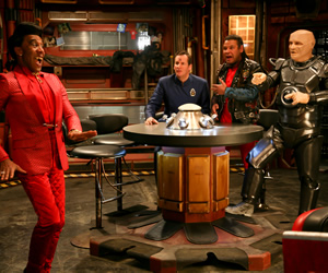 Red Dwarf. Image shows from L to R: Cat (Danny John-Jules), Rimmer (Chris Barrie), Lister (Craig Charles), Kryten (Robert Llewellyn). Copyright: Grant Naylor Productions / BBC