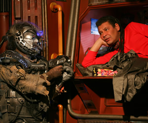 Red Dwarf. Image shows from L to R: Hogey the Roguey (Richard O'Callaghan), Lister (Craig Charles). Copyright: Grant Naylor Productions / BBC