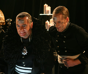 Red Dwarf. Image shows from L to R: Dominator Zlurth (Gary Cady), Chancellor Wednesday (Alex Hardy). Copyright: Grant Naylor Productions / BBC