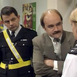 The Thin Blue Line. Image shows from L to R: Inspector Fowler (Rowan Atkinson), D.I. Grim (David Haig), Sergeant Dawkins (Serena Evans). Copyright: Tiger Aspect Productions