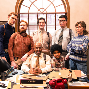 Top Coppers. Image shows from L to R: John Mahogany (Steen Raskopoulos), Mitch Rust (John Kearns), Chief (Donovan Blackwood), Peterson (John Hollingworth), Zach (Rio Myers), McGockey (Phil Wang), Helga (Gabby Best). Copyright: Roughcut Television