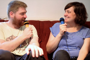 2 Standup Comedians Living In A Flat. Image shows from L to R: Will (William Sirl), Lyns (Lynsey Bonell)