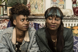 Ackee & Saltfish. Image shows from L to R: Olivia (Michelle O Tiwo), Rachel (Vanessa Babirye). Copyright: BBC