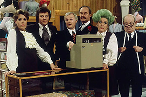 Are You Being Served?. Image shows left to right: Miss Shirley Brahms (Wendy Richard), Mr Dick Lucas (Trevor Bannister), Mr Wilberforce Humphries (John Inman), Captain Stephen Peacock (Frank Thornton), Mrs Betty Slocombe (Mollie Sugden), Mr Ernest Grainger (Arthur Brough). Credit: BBC