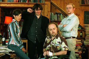 Black Books. Image shows from L to R: Fran Katzenjammer (Tamsin Greig), Bernard Black (Dylan Moran), Manny Bianco (Bill Bailey), Evan (Simon Pegg). Copyright: Assembly Film And Television