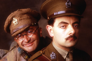 Blackadder. Image shows left to right: Baldrick (Tony Robinson), Captain Edmund Blackadder (Rowan Atkinson). Credit: BBC