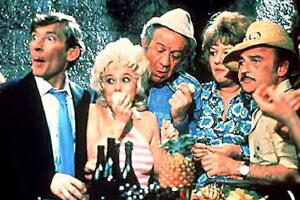 Carry On Abroad. Image shows from L to R: Stuart Farquhar (Kenneth Williams), Sadie Tomkins (Barbara Windsor), Vic Flange (Sid James), Cora Flange (Joan Sims), Stanley Blunt (Kenneth Connor). Copyright: Peter Rogers Productions