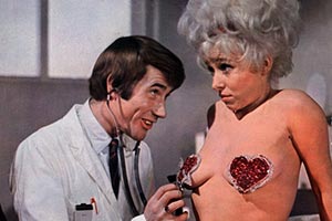 Carry On Again Doctor. Image shows from L to R: Dr James Nookey (Jim Dale), Maud 'Goldie Locks' Boggins (Barbara Windsor)