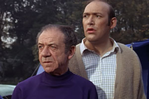 Carry On Camping. Image shows from L to R: Sid Boggle (Sid James), Bernie Lugg (Bernard Bresslaw). Copyright: ITV Studios