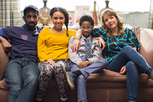 Carters Get Rich. Image shows from L to R: Tony Carter (Rhashan Stone), Ellie Carter (Rhianna Merralls), Harry Carter (Rio Chambers), Liz Carter (Kerry Godliman). Copyright: Roughcut Television