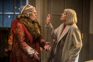 A Christmas Carol Goes Wrong. Image shows from L to R: Scrooge & Himself (Derek Jacobi), Aunt Diana / Narrator (Diana Rigg). Copyright: BBC