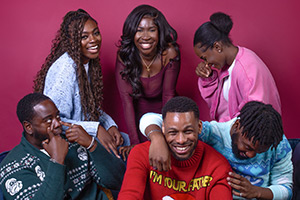 Christmas Games Night. Image shows left to right: Cole (Tevin Deola), Kelechi (Michelle Aramidé), Priscilla (Stacey Ampiah-Roberts), Dylan (David Ajayi), Steph (Arly Ifenedo), Travis (Theo Garshong)