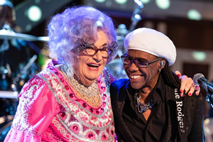 Dame Edna Rules The Waves. Image shows from L to R: Dame Edna Everage (Barry Humphries), Nile Rodgers