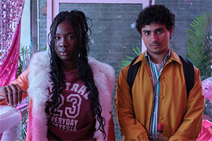 Dead Hot. Image shows left to right: Jess (Vivian Oparah), Elliot (Bilal Hasna)