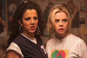 Derry Girls. Image shows left to right: Michelle Mallon (Jamie-Lee O'Donnell), Erin Quinn (Saoirse-Monica Jackson). Credit: Hat Trick Productions