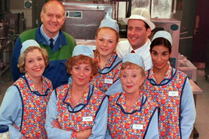 dinnerladies. Image shows from L to R: Jean (Anne Reid), Stan (Duncan Preston), Brenda (Victoria Wood), Twinkle (Maxine Peake), Dolly (Thelma Barlow), Tony (Andrew Dunn), Anita (Shobna Gulati). Copyright: Good Fun / Pozzitive Productions