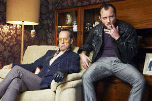 Dom Hemingway. Image shows from L to R: Dickie (Richard E. Grant), Dom Hemingway (Jude Law)