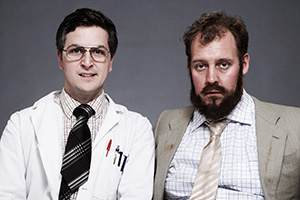 Double Science. Image shows left to right: Colin Jackson (Ben Willbond), Kenneth Farley-Pitman (Justin Edwards). Credit: BBC