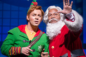 Elf: The Musical. Image shows from L to R: Buddy (Ben Forster), Santa Claus (Louis Emerick)