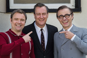 Eric, Ernie And Me. Image shows from L to R: Ernie Wise (Neil Maskell), Eddie Braben (Stephen Tompkinson), Eric Morecambe (Mark Bonnar). Copyright: Objective Productions
