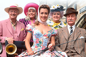 Grace & Favour. Image shows left to right: Mr. Wilberforce Clayborne Humphries (John Inman), Miss Shirley Brahms (Wendy Richard), Jessica Lovelock (Joanne Heywood), Mrs. Betty Slocombe (Mollie Sugden), Captain Stephen Peacock (Frank Thornton). Credit: BBC