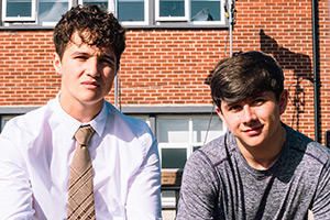G'wed. Image shows left to right: Christopher (Jake Kenny-Byrne), Reece (Dylan Thomas-Smith)