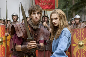 Horrible Histories: The Movie - Rotten Romans. Image shows from L to R: Atti (Sebastian Croft), Orla (Emilia Jones). Copyright: Nick Wall