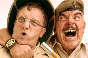 Image shows left to right: Gunner 'Lofty' Sugden (Don Estelle), BSM Geoffrey 'Shut Up' Williams (Windsor Davies). Credit: BBC