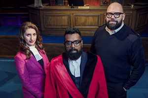 Judge Romesh. Image shows from L to R: Court Clerk (Jessica Knappett), Romesh Ranganathan, Court Bailiff (Tom Davis). Copyright: Hungry Bear Media