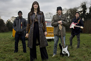 Kat And The Band. Image shows from L to R: Sid (Idris Debrand), Kat Malone (Ella Hunt), Alex (Dougie Poynter), Brian (Callum McGowan)