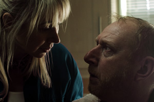 Making A Killing. Image shows from L to R: The Handyperson (Tiffany Stevenson), Mr Loveless (Adrian Scarborough)