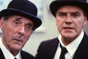 Photograph courtesy of Revelation Films. Image shows from L to R: Senior Undertaker (Eric Sykes), Short Undertaker (Freddie Starr). Copyright: Thames Television