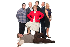 Mrs. Brown's Boys. Image shows from L to R: Dermot Brown (Paddy Houlihan), Rory Brown (Rory Cowan), Agnes Brown (Brendan O'Carroll), Father Damien (Conor Moloney), Mark Brown (Pat Shields), Cathy Brown (Jennifer Gibney), Grandad Brown (Dermot O'Neill)