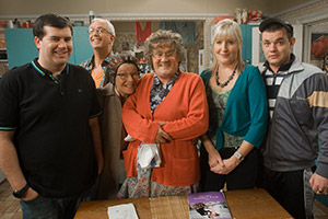 Mrs. Brown's Boys. Image shows from L to R: Dermot Brown (Paddy Houlihan), Rory Brown (Rory Cowan), Winnie McGoogan (Eilish O'Carroll), Agnes Brown (Brendan O'Carroll), Cathy Brown (Jennifer Gibney), Buster Brady (Danny O'Carroll). Copyright: BBC