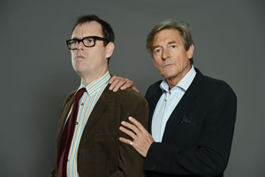 Murder On The Blackpool Express. Image shows from L to R: Kevin (Kevin Eldon), Doc (Nigel Havers)