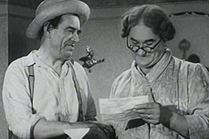 Over The Garden Wall. Image shows left to right: Joe Laughton (Jimmy James), Fanny Laughton (Norman Evans)