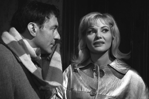 Rattle Of A Simple Man. Image shows left to right: Percy Winthram (Harry H. Corbett), Cyrenne Martelli (Diane Cilento). Credit: STUDIOCANAL