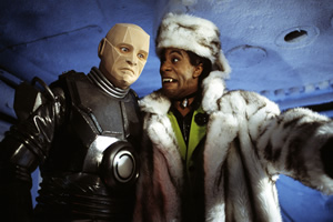 Red Dwarf. Image shows from L to R: Kryten (Robert Llewellyn), Cat (Danny John-Jules). Copyright: BBC