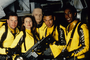 Red Dwarf. Image shows from L to R: Rimmer (Chris Barrie), Kochanski (Chloë Annett), Kryten (Robert Llewellyn), Lister (Craig Charles), Cat (Danny John-Jules). Copyright: BBC