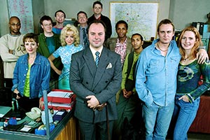 Roger Roger. Image shows from L to R: Andre (Terence Maynard), Reen (Pippa Guard), Cambridge (Chris Larkin), Marlon (Ricci Harnett), Tina (Barbara Durkin), Baz (David Ross), Sam (Robert Daws), Barry (Jonathan Moore), Henry (Jude Akuwudike), Rajiv (Paul Sharma), Phil (Philip Glenister), Chrissie (Helen Grace). Copyright: BBC