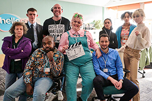 Ruby Speaking. Image shows left to right: Donna (Nicky Goldie), Craig (Dan Hiscox), Cameron (Jamal Franklin), Tom (Joe Sims), Ruby (Jayde Adams), Mark (Sam Swainsbury), Ellie (Amy-Leigh Hickman), Melons (Kiera Lester), Vicki (Katherine Kelly). Credit: Yellow Door Productions