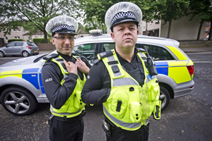 Scot Squad. Image shows from L to R: PC Surjit Singh (Manjot Sumal), PC Hugh McKirdy (Graeme Stevely). Copyright: The Comedy Unit