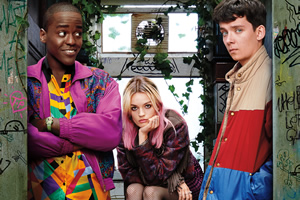 Sex Education. Image shows from L to R: Eric Effiong (Ncuti Gatwa), Maeve Wiley (Emma Mackey), Otis Milburn (Asa Butterfield). Copyright: Eleven Film