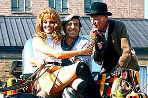 Steptoe & Son. Image shows from L to R: Zita (Carolyn Seymour), Harold (Harry H. Corbett), Albert (Wilfrid Brambell). Copyright: Associated London Films Limited