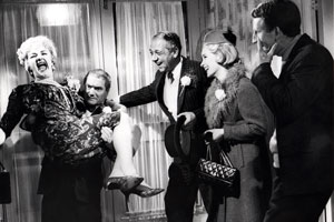 The Big Job. Image shows from L to R: Mildred Gamely (Joan Sims), Frederick 'Booky' Binns (Dick Emery), George 'The Great Brain' (Sid James), Myrtle Robbins (Sylvia Syms), Timothy 'Dipper' Day (Lance Percival). Copyright: Anglo Amalgamated