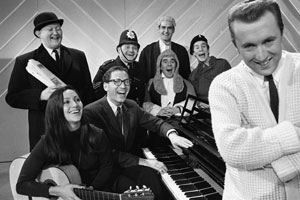 The Frost Report. Image shows left to right: Nicholas Smith, Julie Felix, Tom Lehrer, Ronnie Barker, John Cleese, Ronnie Corbett, Nicky Henson, David Frost. Credit: BBC